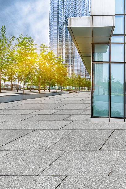 istock empty pavement and modern buildings in city 588217992