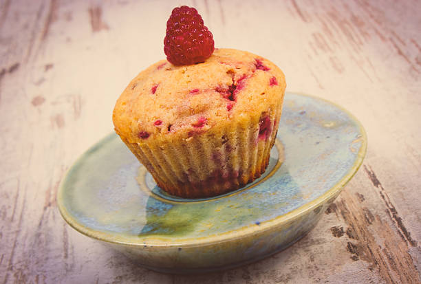 istock Fresh baked cupcake with raspberries and chocolate, delicious dessert 588219288