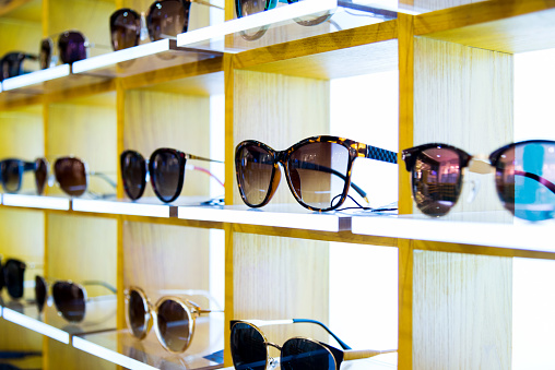 Group of sunglasses in shop.