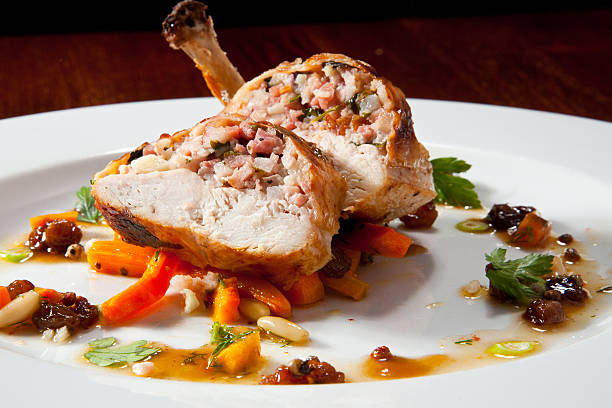 istock Stuffed Chicken Leg on Vegetable Cushion 588222606