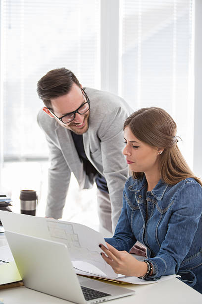 istock Business people reviewing documents and plans 588225246