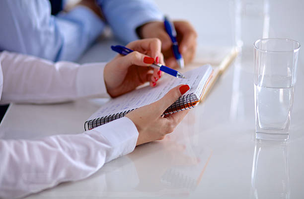 istock Attractive female doctor shaking a patient's hands in her 588226410