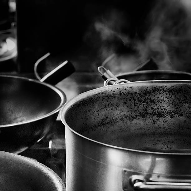 istock Pots and pans in black and white view of kitchen 588229232