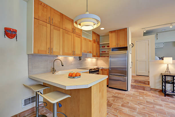 istock Light brown kitchen interior with steel appliances 588233254