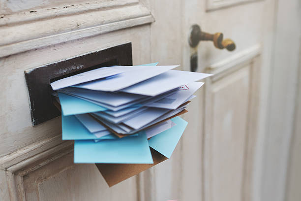 Jam-packed with the post Cropped shot of letters in a letter box mailbox photos stock pictures, royalty-free photos & images