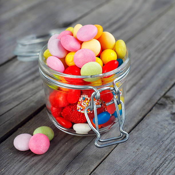 istock Colorful candies in small jar 588239108