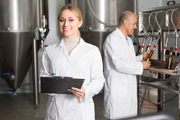 istock Female worker on beer brewery 588240758