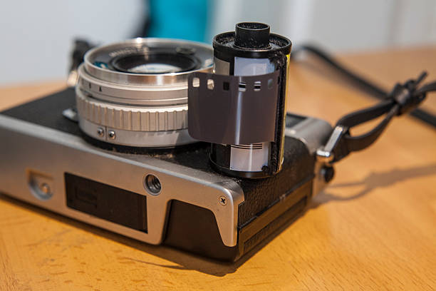 istock Antique reflex camera with film roll 588245898