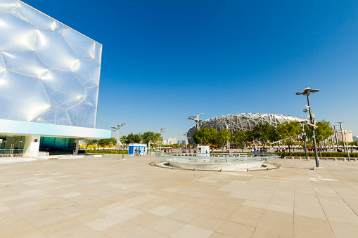Beijing, China - October 31, 2015: National Aquatic Centre, Water Cube, at the Beijing Olympic Sport Center, with the Olympic Stadium, Bird's Nest, in the background
