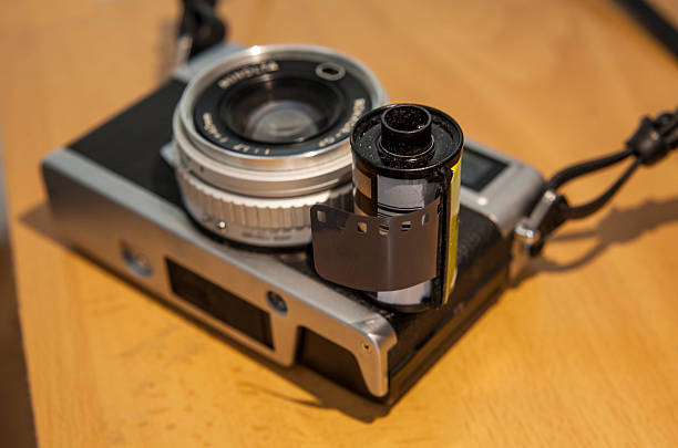 istock Antique reflex camera with film roll 588246022