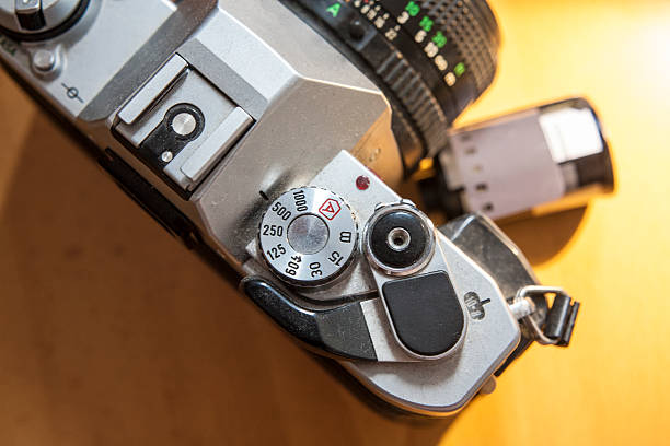 istock Antique reflex camera with film roll 588246246