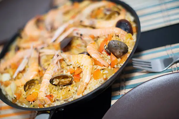Photo of Seafood paella with mussels and shrimps