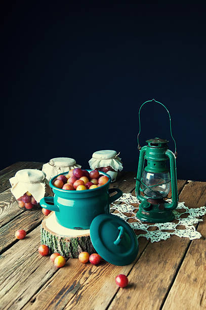 istock Preparation of plums with sugar in jars for winter 588248470