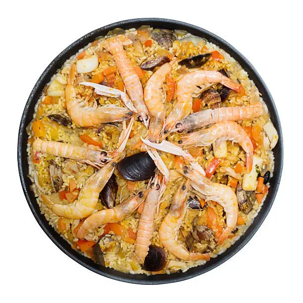 Photo of Valencian rice dish with seafood paella isolated