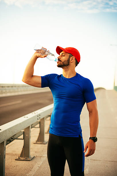 istock Male athlete refreshing with cold water 588251418