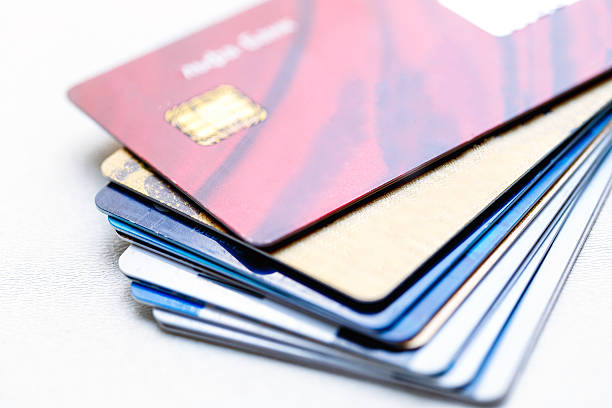 istock pile of credit cards on white background 588252162