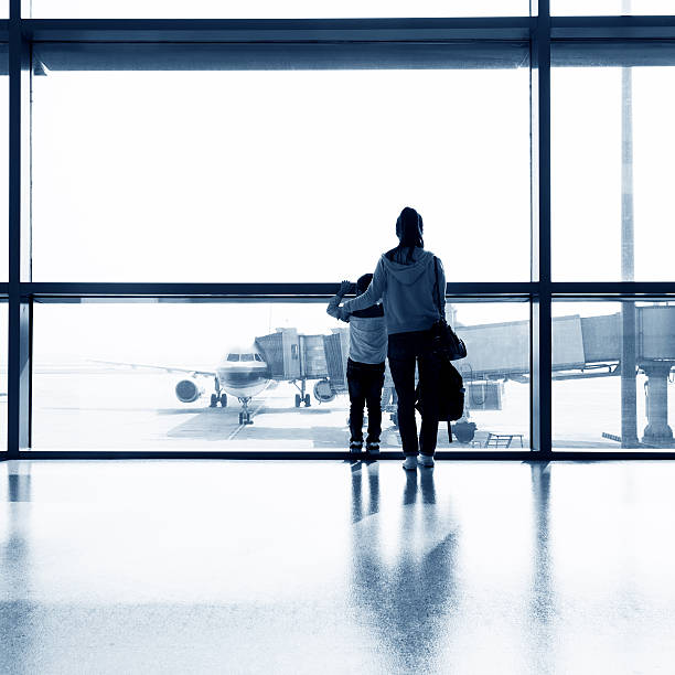 istock Asian mother and son at airport 588253222