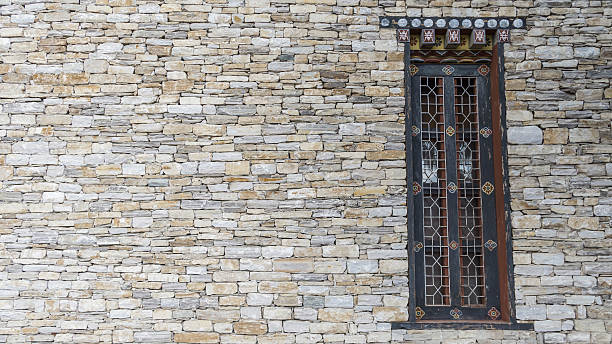 istock Wood window vintage with stone brick 588253850