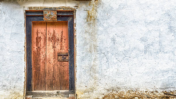 istock wood door vintage with white wall 588253990