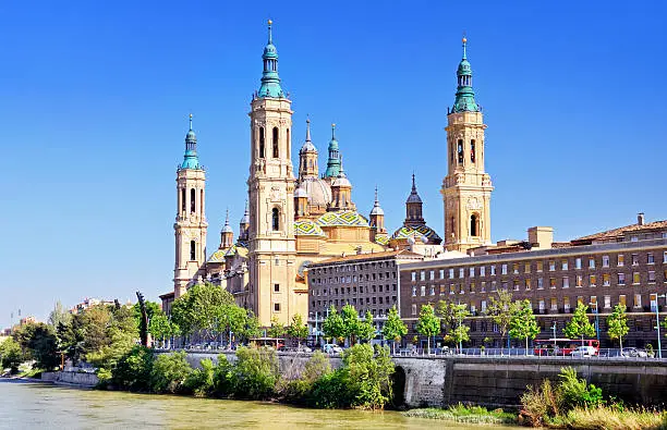 Basilica of Our Lady of the Pillar and Ebro river, Zaragoza, Spain. Composite photo