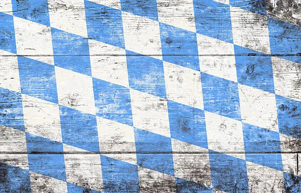 Beer Fest background with blue and white rhombus pattern. Wooden background. Studio shot.