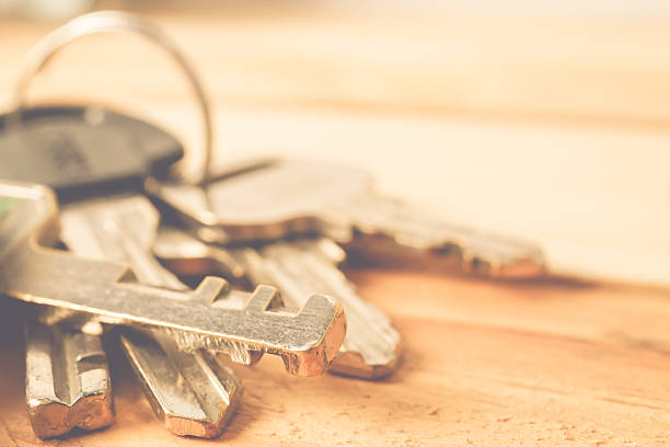 Bunch of keys on a wooden table