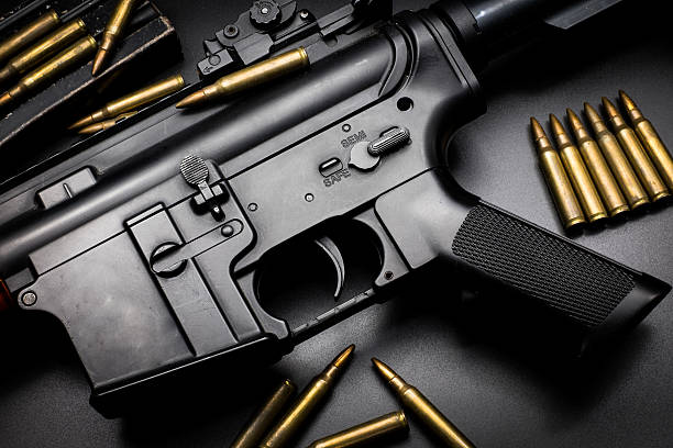 istock M4A1 assult rifle on black background 588258278