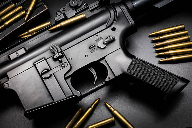 istock M4A1 assult rifle on black background 588258330