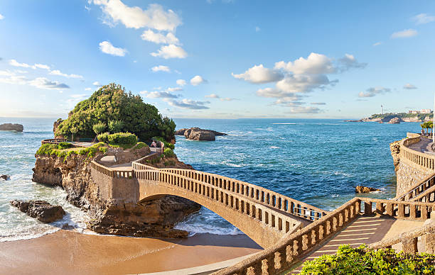 brücke zur insel in biarritz - baskenland stock-fotos und bilder