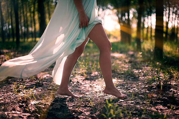 istock Walking woman in the forest. 588259768