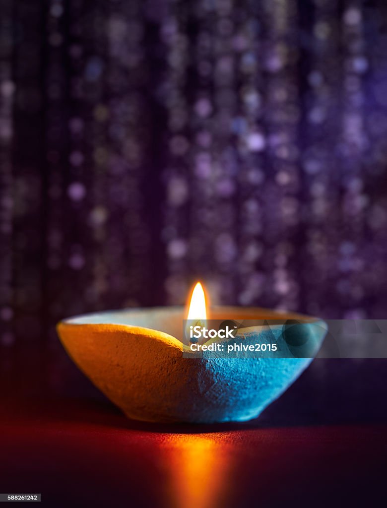 Diwali oil lamp Traditional clay diya lamps lit during diwali celebration Bright Stock Photo