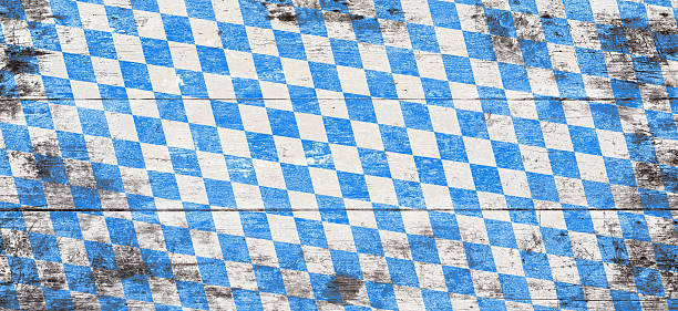 Beer Fest background with blue and white rhombus pattern. Wooden background. Studio shot.