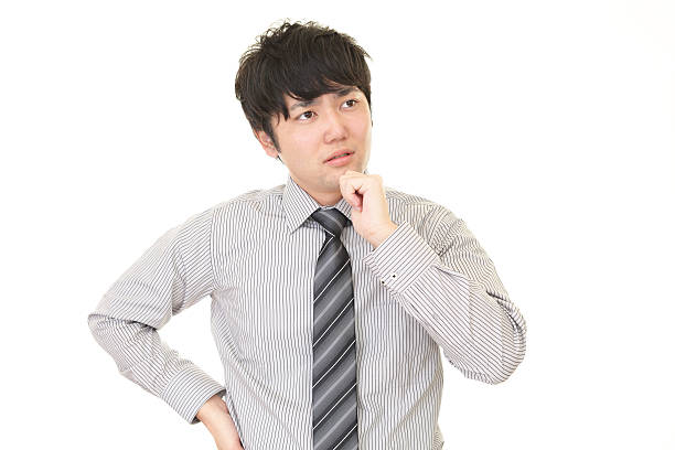 istock Uneasy Asian Businessman 588265402