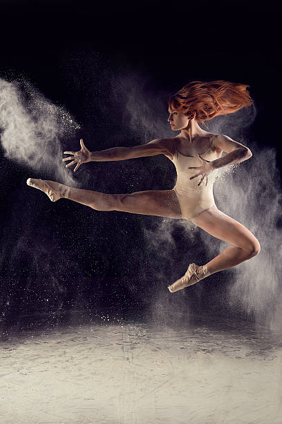 istock Dancer high jump and the explosion of white dust 588265626