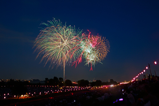 Itabashi Ward and Toda City, Tokyo, Japan - August 6, 2016: The 57th Itabashi Fireworks and the 63rd Todabashi Fireworks held at the same time on the riverbank of Ara River (also known as Arakawa River).