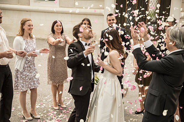 istock Bride and groom holding champagne flute 588267508