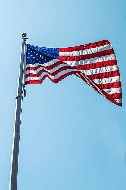 istock American USA Flag flying vertical 588268296