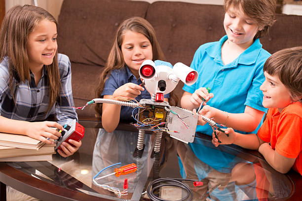 istock Children build robot together at home. 588271132