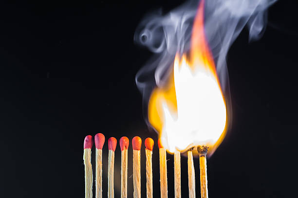 istock fire from the burning  matches in dark background 588354248