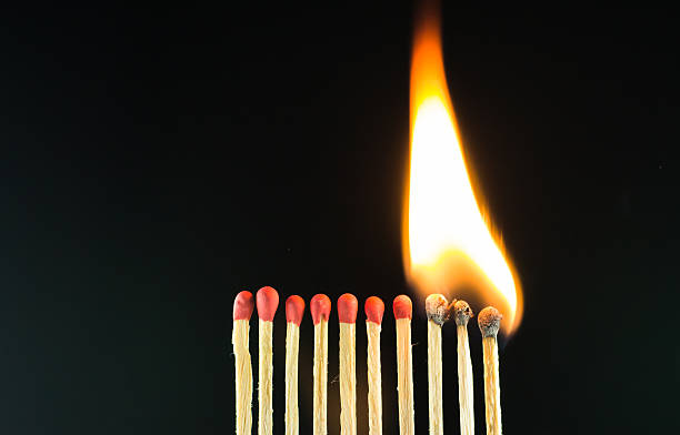 istock fire from the burning  matches in dark background 588354274