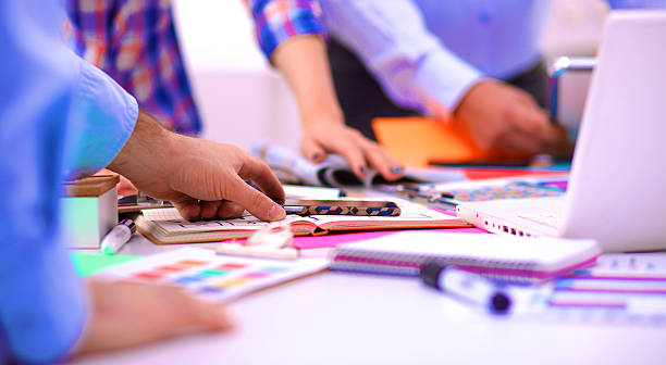 istock Young business people working at office on new project 588355068