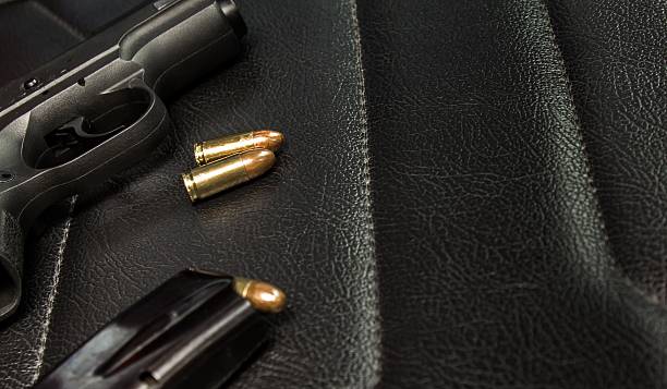istock Pistol 9 mm with magazine and ammunition 588355176