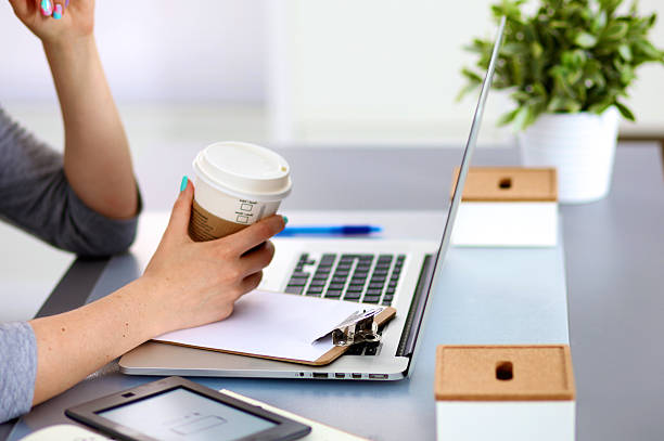 istock Young businesswoman working on a laptop 588355620