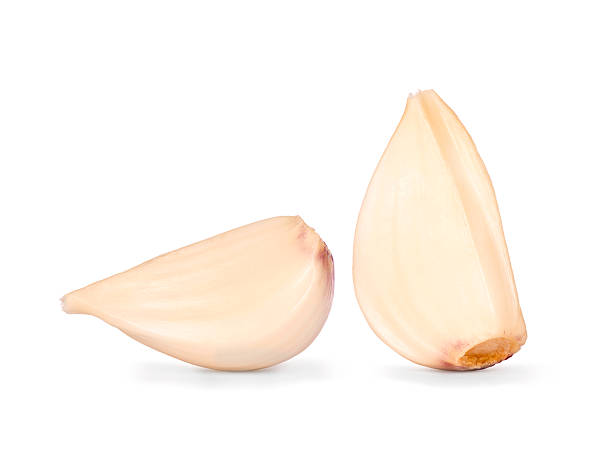 istock Garlic cloves close up isolated on the white background 588357824