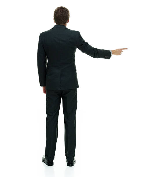 istock Rear view of businessman pointing away 588357840