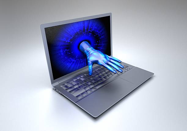 istock Hand comes out of the computer screen 588360652