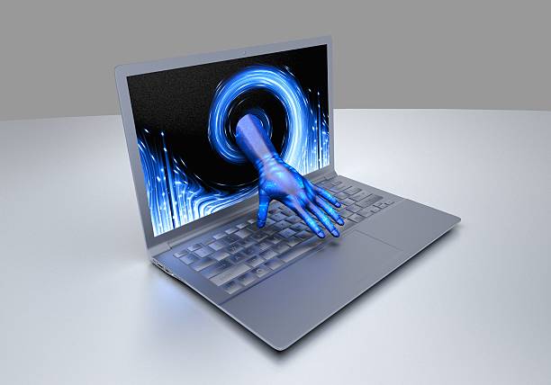 istock Hand comes out of the computer screen 588360684