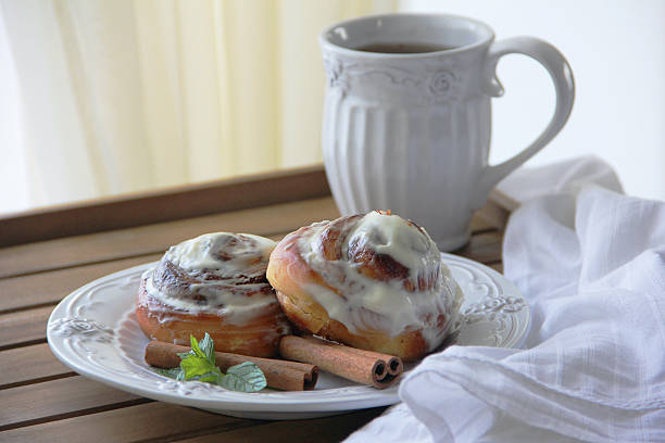 istock Homemade cinnabons cinnamon rolls with cream glaze. 588360706