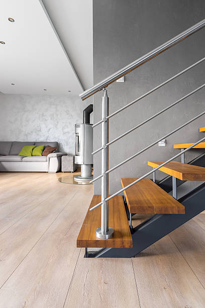 istock Spacious villa interior with wooden staircase idea 588360824