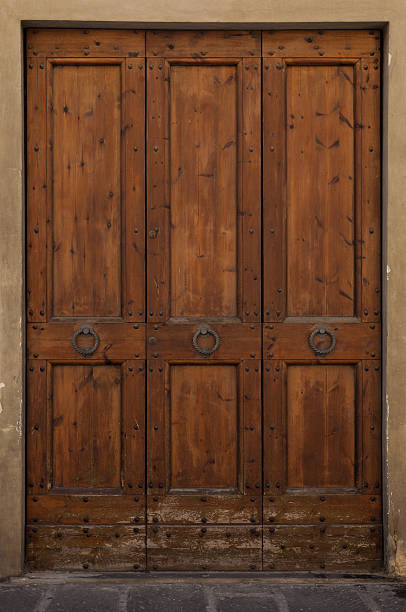 istock Old wooden door - Italy 588363284